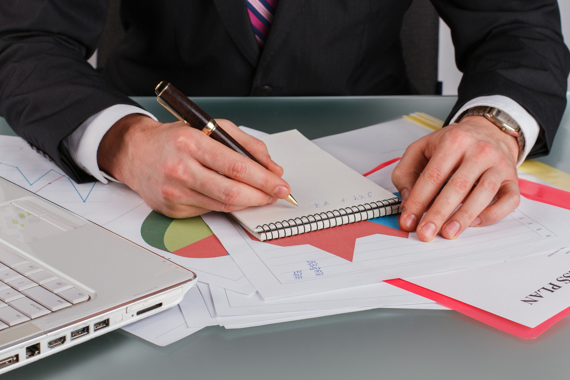 Close up businessman working with financial documents at office.